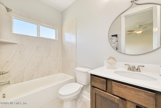 full bath featuring ceiling fan, toilet, bathtub / shower combination, and vanity