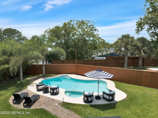 view of swimming pool featuring a patio, a yard, a fenced backyard, and a fenced in pool