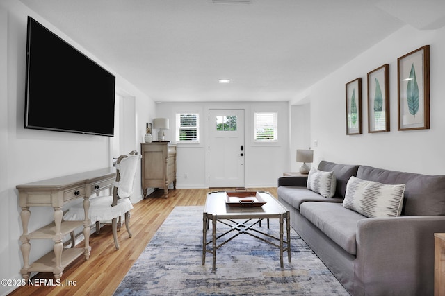 living area with light wood-style floors