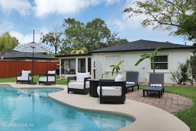 back of house featuring stucco siding, an outdoor living space, a patio, fence, and a fenced in pool