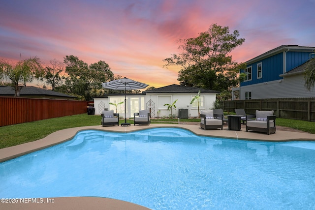 pool at dusk featuring a fenced in pool, cooling unit, outdoor lounge area, a fenced backyard, and a patio area