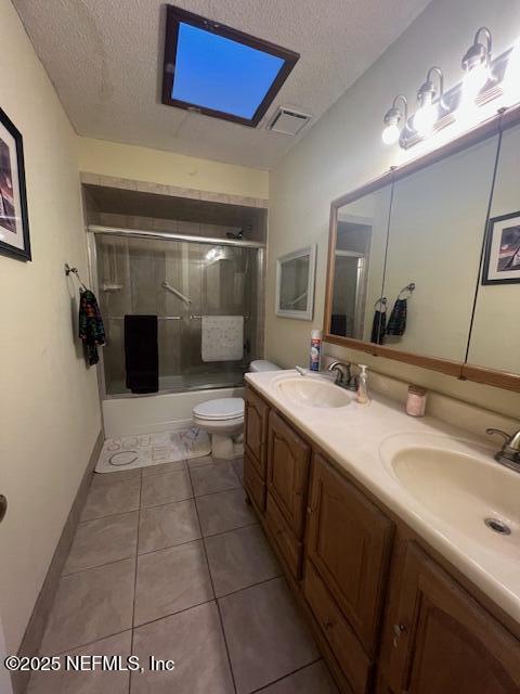 bathroom with visible vents, a sink, a textured ceiling, and toilet