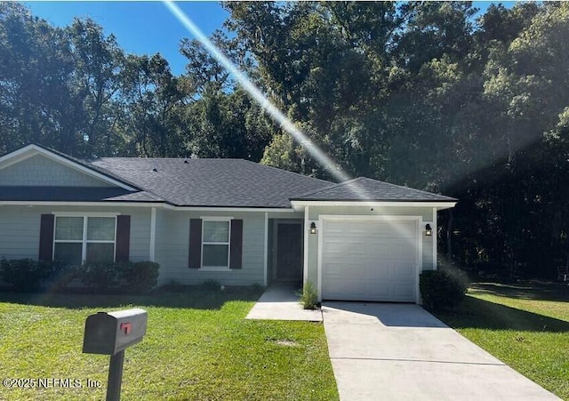 single story home with a garage, concrete driveway, a shingled roof, and a front yard