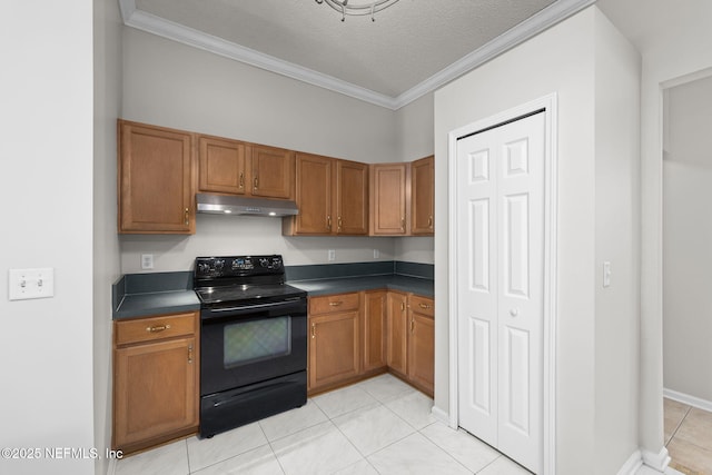 kitchen with under cabinet range hood, black electric range, brown cabinets, dark countertops, and crown molding