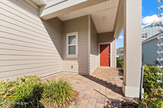 property entrance with a patio