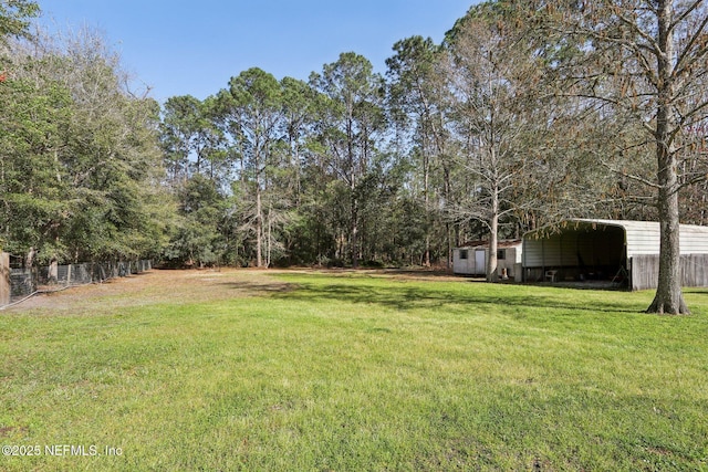 view of yard with a detached carport