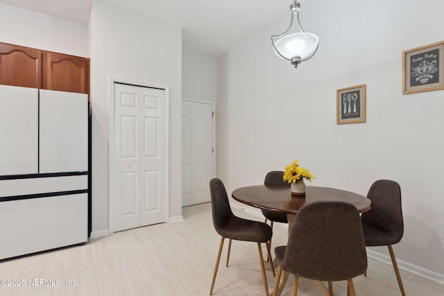 dining room with baseboards