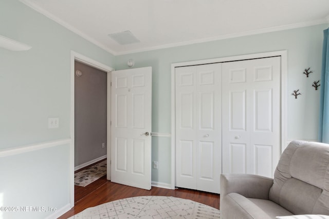 sitting room with ornamental molding, dark wood-style flooring, and baseboards