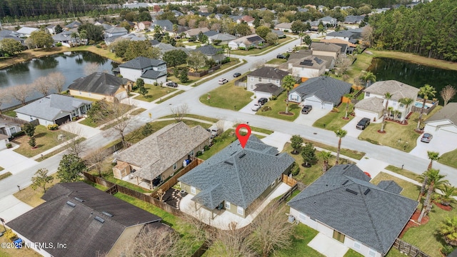 aerial view with a water view and a residential view