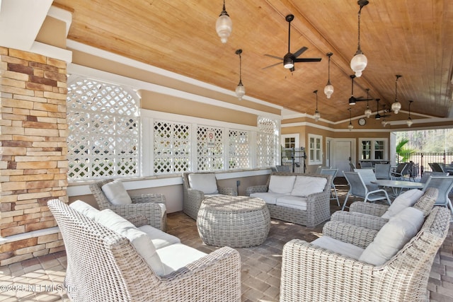 view of patio / terrace with a ceiling fan, outdoor dining area, fence, and an outdoor hangout area