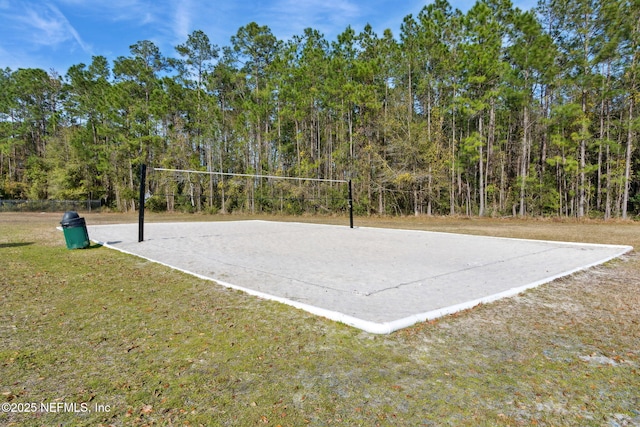 view of community featuring a lawn and volleyball court