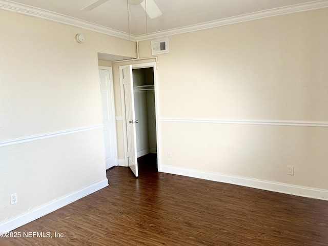 unfurnished bedroom featuring ornamental molding, dark wood finished floors, visible vents, and baseboards