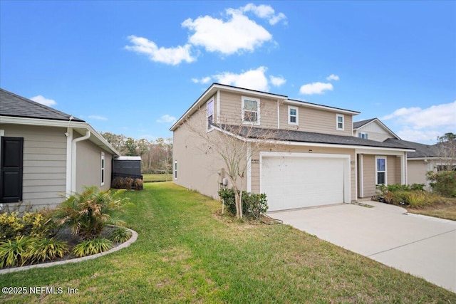 view of side of property with an attached garage, concrete driveway, and a yard