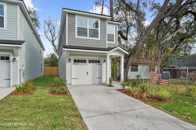 traditional-style home featuring a garage, concrete driveway, a front lawn, and fence