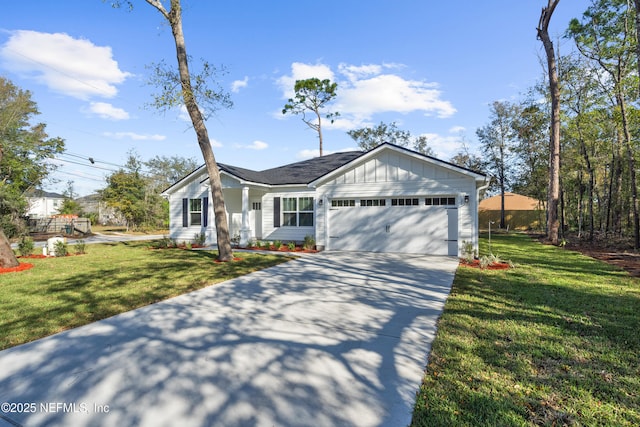 ranch-style home featuring a garage, driveway, board and batten siding, and a front lawn