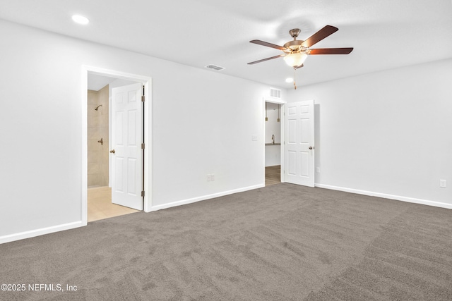 unfurnished bedroom featuring visible vents, recessed lighting, baseboards, and carpet