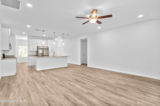 unfurnished living room featuring recessed lighting, visible vents, and light wood-style flooring