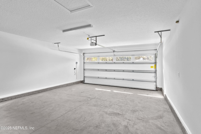 garage with a garage door opener and baseboards