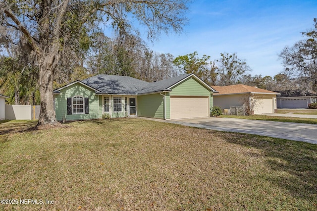 single story home featuring an attached garage, driveway, fence, and a front yard