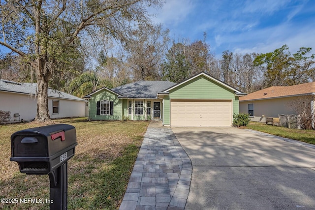 ranch-style home with a garage, a front lawn, and concrete driveway