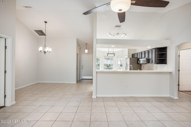 kitchen with light tile patterned floors, stainless steel appliances, open shelves, visible vents, and ceiling fan with notable chandelier