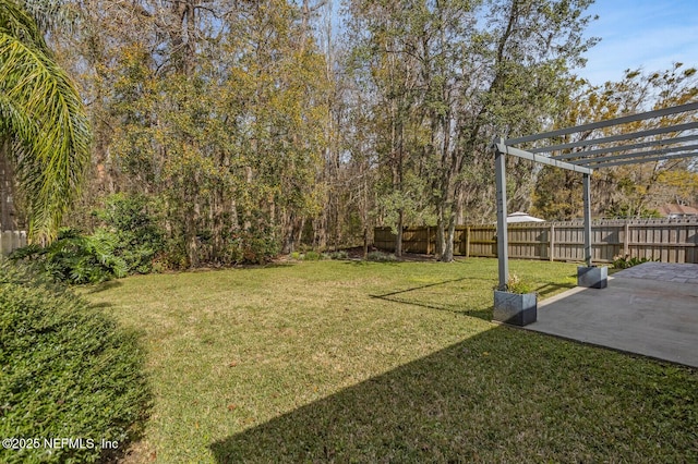 view of yard with fence, a pergola, and a patio