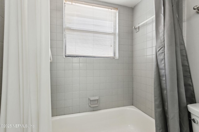 full bathroom featuring shower / tub combo with curtain and toilet