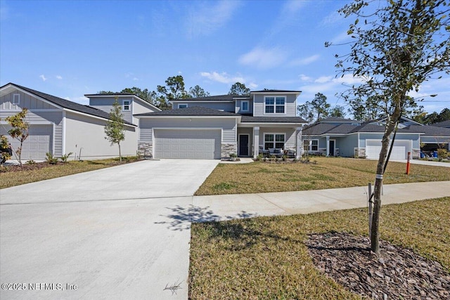 view of front of house featuring concrete driveway, stone siding, a front lawn, and an attached garage