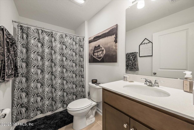 bathroom featuring a shower with shower curtain, toilet, a textured ceiling, vanity, and tile patterned flooring