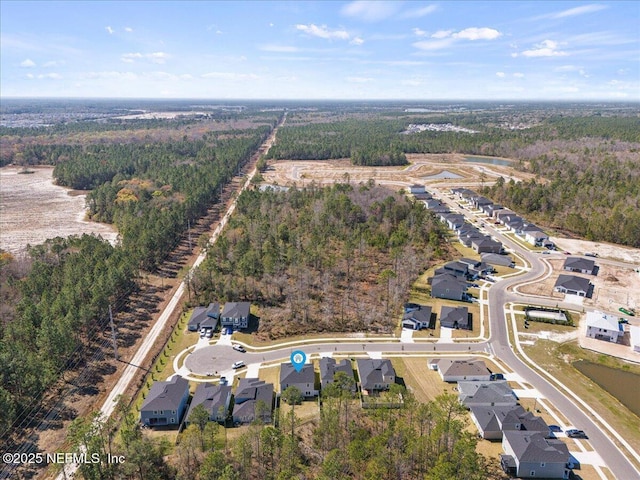 bird's eye view with a forest view