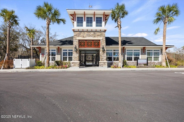 view of building exterior with fence