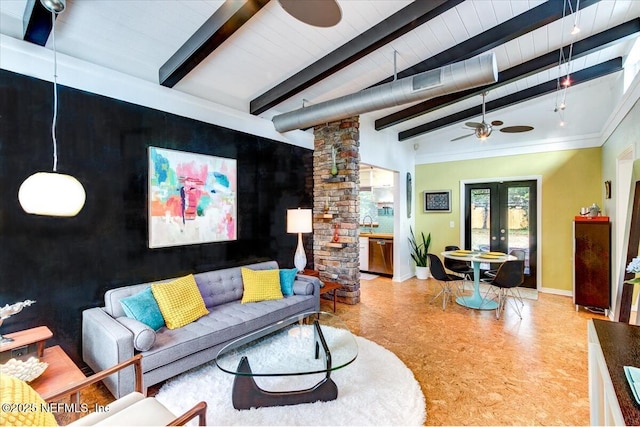 living room with beam ceiling, french doors, ornate columns, a ceiling fan, and baseboards