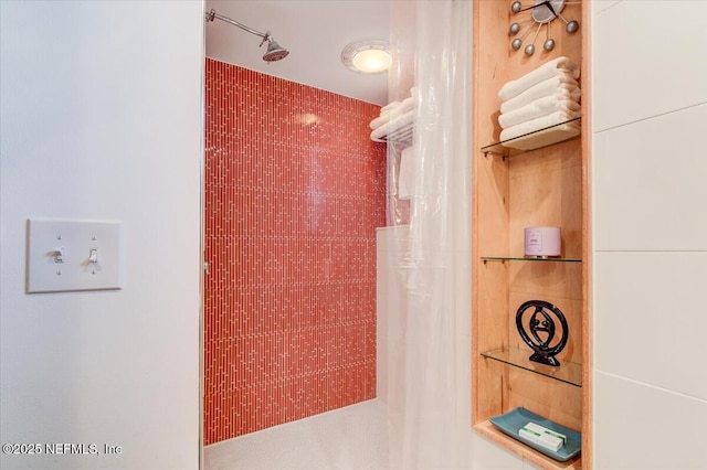 full bath featuring tiled shower