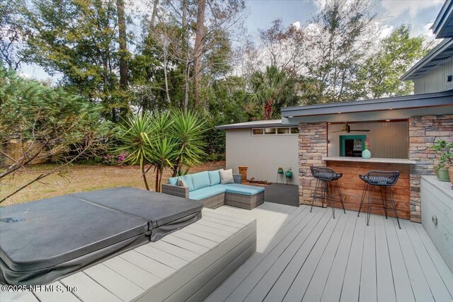 wooden deck with outdoor dry bar