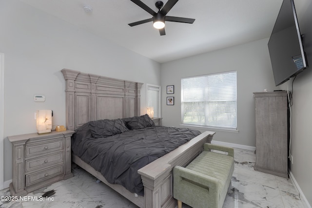 bedroom with marble finish floor, baseboards, and a ceiling fan