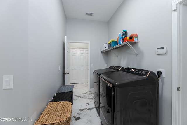 laundry room featuring marble finish floor, visible vents, laundry area, and washer and clothes dryer