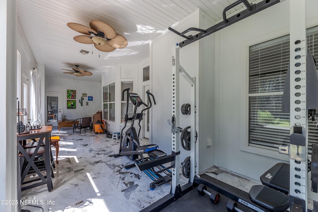 exercise area featuring wood ceiling, marble finish floor, and a ceiling fan