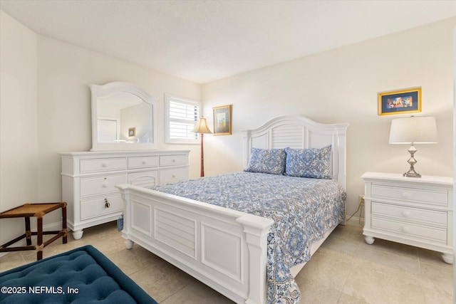 bedroom featuring baseboards