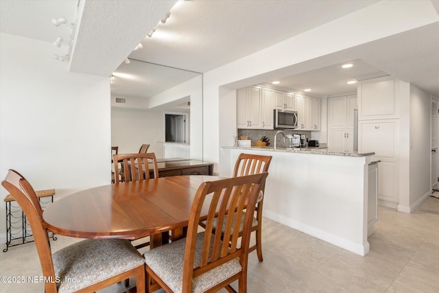 dining area with recessed lighting, baseboards, and visible vents