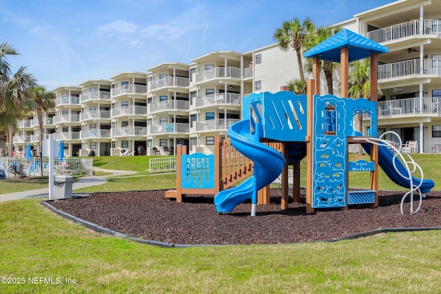 community play area featuring a lawn