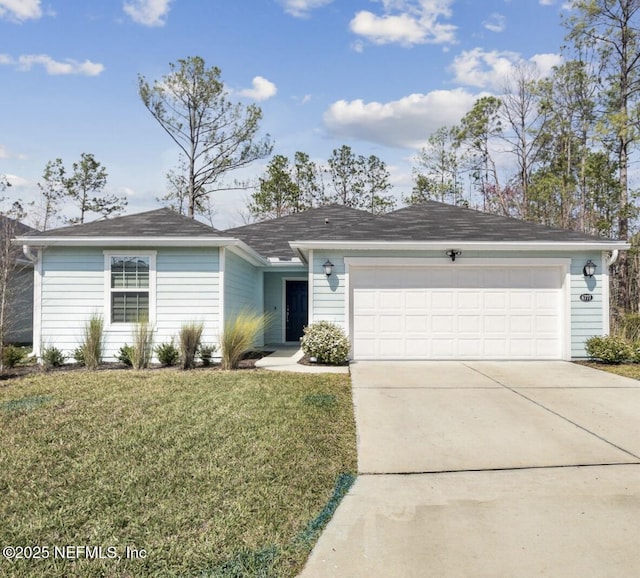 ranch-style home featuring a front lawn, concrete driveway, and an attached garage