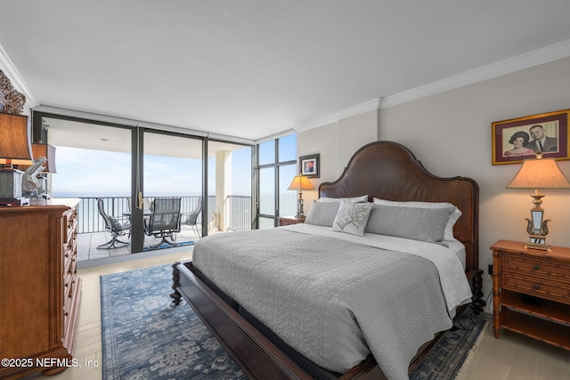 bedroom featuring ornamental molding, access to outside, floor to ceiling windows, and light wood finished floors