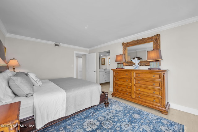 bedroom with baseboards, connected bathroom, visible vents, and crown molding