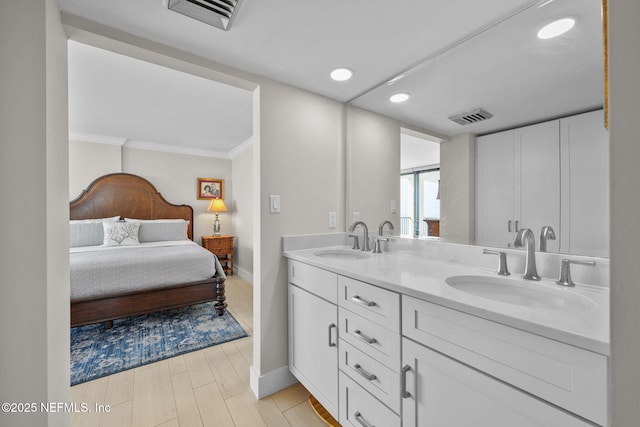 full bathroom featuring double vanity, visible vents, and a sink