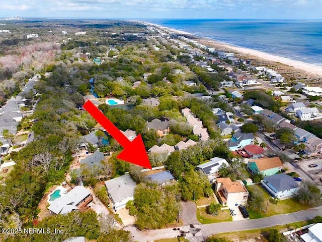 bird's eye view with a view of the beach, a water view, and a residential view