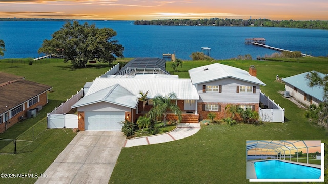 birds eye view of property featuring a water view