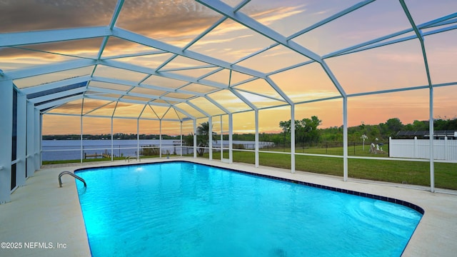 view of swimming pool featuring a fenced in pool, a patio, a lanai, fence, and a yard