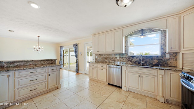 kitchen with appliances with stainless steel finishes and cream cabinets