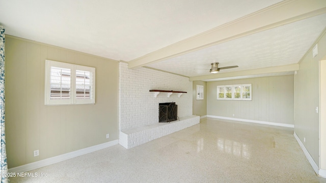 unfurnished living room featuring baseboards, ceiling fan, speckled floor, a fireplace, and beam ceiling