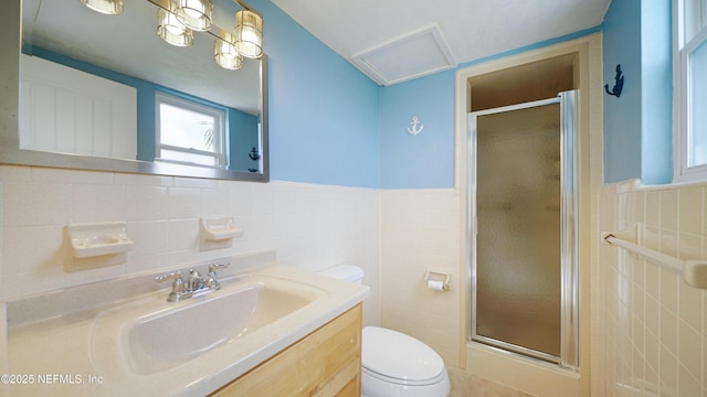 full bath with a shower stall, wainscoting, tile walls, and toilet